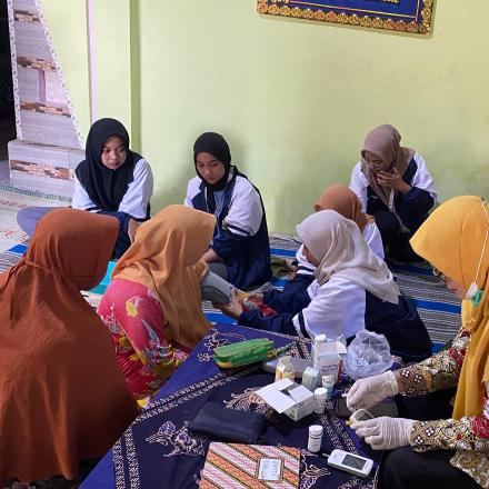 Membantu Kegiatan Posyandu dan Mengajar TPQ 